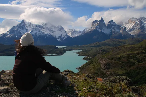chile-patagonia-torres-del-paine-patagonia-camp-girl-sitting-view-over-massif